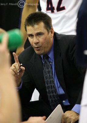 Arizona Wildcats interim Head Coach Russ Pennell addresses his team during a timeout