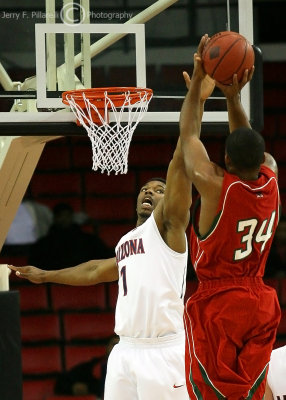 Arizona F Onobun goes up in an attempt to block the shot of Mississippi Valley State F Eric Petty