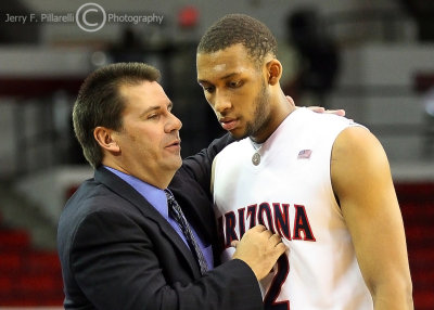 Arizona Wildcats interim Head Coach Russ Pennell talks to F Horne as he comes back to the bench