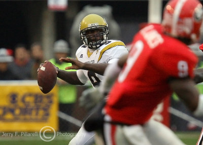 Yellow Jackets QB Josh Nesbitt looks for an open receiver downfield