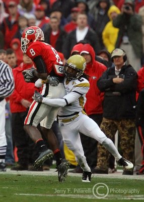 Georgia Tech CB Mario Butler brings down Georgia FLK A.J. Green after a catch