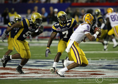 Jackets LB Brad Jefferson and LB Clark chase Tigers QB Jefferson from the pocket