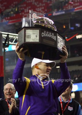 Louisiana State University Tigers Head Coach Les Miles accepts the 2008 Chick-fil-a Bowl trophy