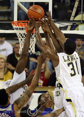 Yellow Jackets F Lawal fights for a rebound