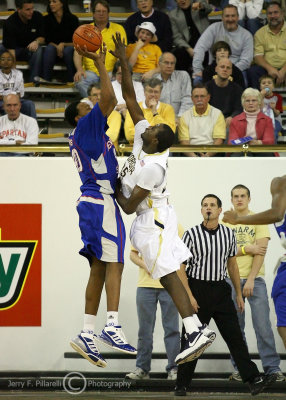 Georgia Tech F Peacock goes up to defend the jumper by TSU F Evans