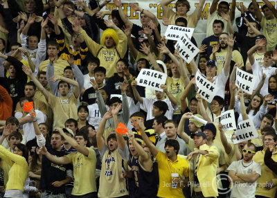 Georgia Tech Yellow Jackets fans attempt to distract a Duke free throw shooter
