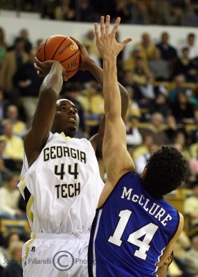 Yellow Jackets F Aminu shoots over Blue Devils F McClure