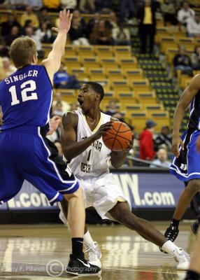 Jackets G Shumpert picks up his dribble and looks to pass around Devils F Singler