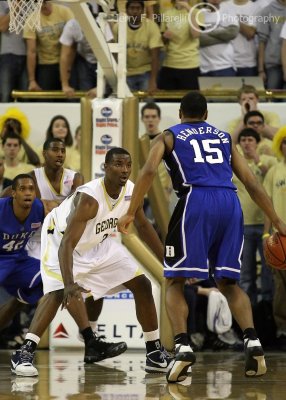Yellow Jackets F Lawal gets in front of Blue Devils G Gerald Henderson