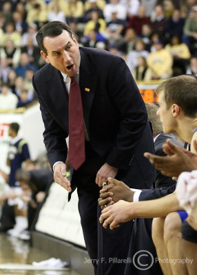 Duke Blue Devils Head Coach Mike Krzyzewski shouts at his players on the bench