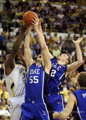 Georgia Tech F Peacock attempts to grab a rebound over Duke C Zoubek and F Singler