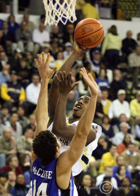 Yellow Jackets G Shumpert shoots over the defense of Blue Devils F McClure