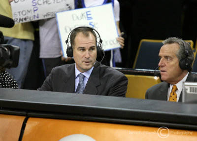 ESPN correspondents Jay Bilas and Brad Nessler comment on the game during a break in the action