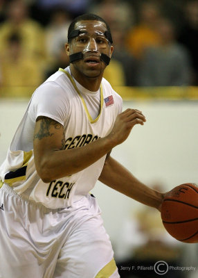 Yellow Jackets G Maurice Miller brings the ball up court