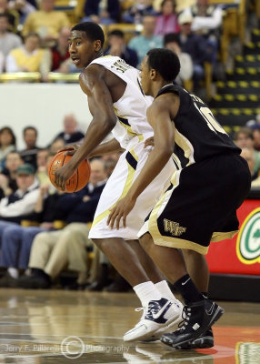 Georgia Tech G Iman Shumpert dribbles around the perimeter while defended by Wake Forest G Ishmael Smith
