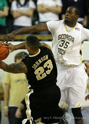 Georgia Tech F Peacock attempts to knock the ball from the hands of Wake Forest F James Johnson