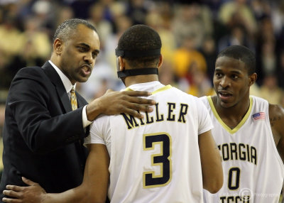 Georgia Tech Yellow Jackets Head Coach Paul Hewitt talks to G Miller and Clinch during a break in the action