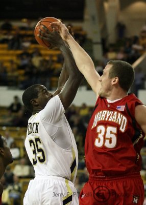 Jackets F Peacock takes a shot over the outstretched hand of Maryland F Dave Neal