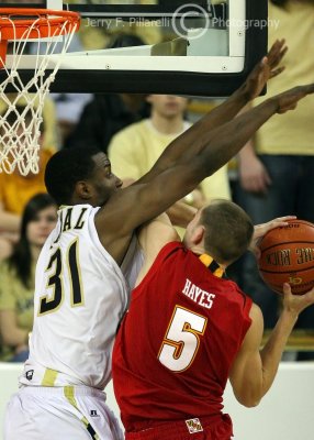 Yellow Jackets F Lawal goes up to stop a shot by Terrapins G Hayes