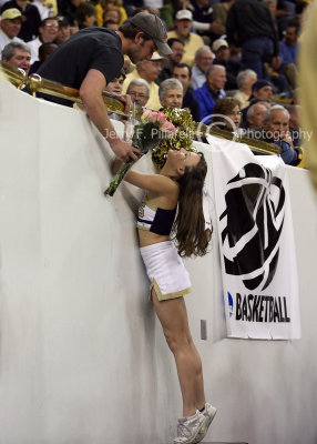 Yellow Jackets cheerleader gets a Valentines Day bouquet from an admirer