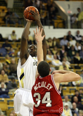 Yellow Jackets F Lawal elevates and shoots over Wolfpack C McCauley