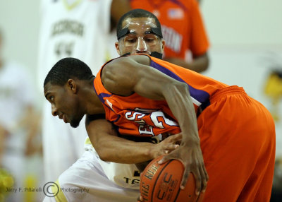 Yellow Jackets G Maurice Miller reaches in to steal the ball from Tigers G Stitt