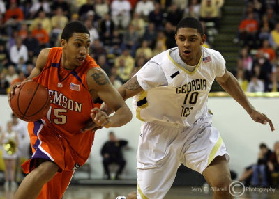 Yellow Jackets G Storrs moves in to defend the drive of Tigers F David Potter