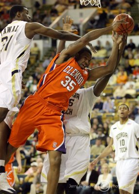 Jackets F Lawal goes over Tigers F Booker to deny him an offensive rebound