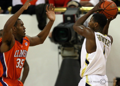 Georgia Tech G Shumpert looks to pass over the outstretched arms of Clemson F Booker