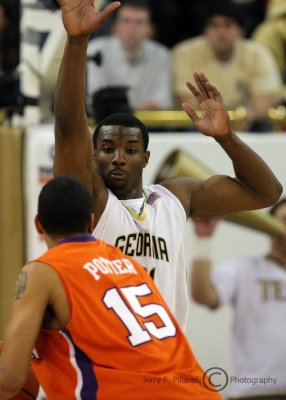 Jackets F Lawal gets his hands up to defend against Tigers F Potter