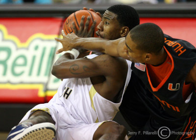 Georgia Tech G Iman Shumpert gets down on the floor and wrestles for the ball with Miami G Lance Hurdle