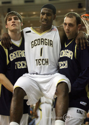 Jackets G Shumpert is carried off the court by teammates Sam Shew and Ty Anderson