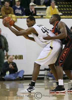 Yellow Jackets F Aminu is harassed by a Hurricanes defender