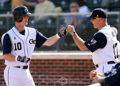 ...Yellow Jackets DH Thomas Nichols is congratulated by Coach Hall after his home run