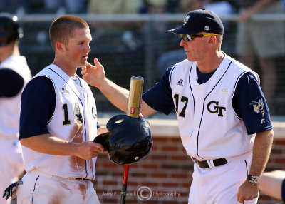 Georgia Tech 2B Patrick Long is welcomed back to the dugout by Coach Hall