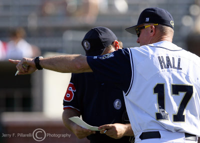 Georgia Tech Head Coach Danny Hall dictates a lineup change to the plate umpire