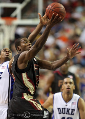 Seminoles G Douglas avoids a Blue Devils defender and completes the lay up