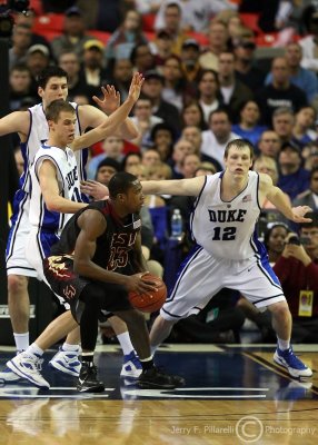 Seminoles G Douglas is triple teamed by Blue Devils defenders