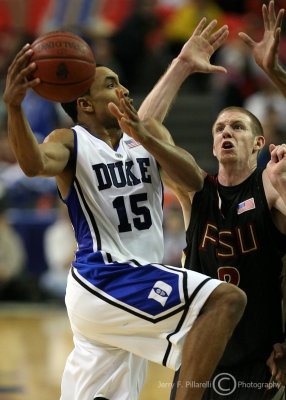 Duke G Henderson looks to drive as he is harassed by Florida St. F Jordon DeMercy