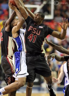 Seminoles F Uche Echefu stuffs a Blue Devils player near the basket