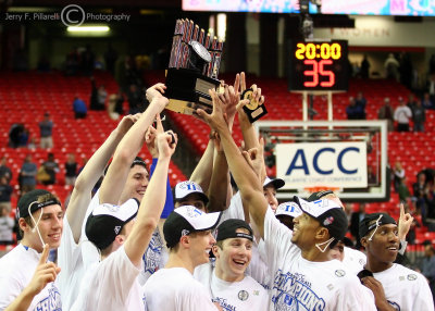 Duke Blue Devils team members hoist the 2009 ACC Championship trophy