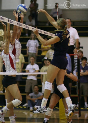 GT MB Stawicka spikes the ball through a Lady Governors block