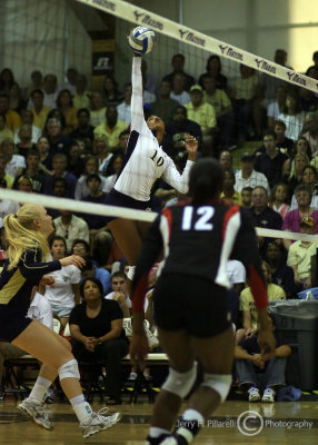 Yellow Jackets OH Chrissy DeMichelis makes contact at the net