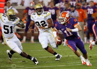Jackets LB Brad Jefferson chases Tigers QB Parker out of the pocket