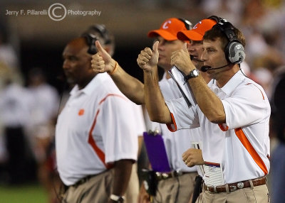 Clemson Tigers Head Coach Dabo Swinney signals his offense from the sidelines
