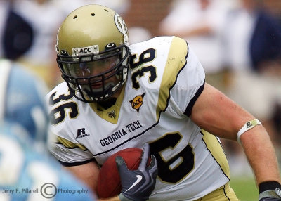 Jackets A-back Lucas Cox stares down a UNC defender