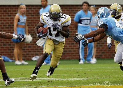 Georgia Tech A-back Orwin Smith breaks through the line of scrimmage