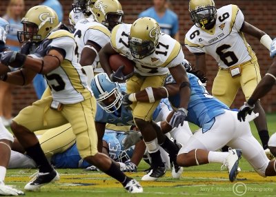 Jackets A-back Smith attempts to break a tackle