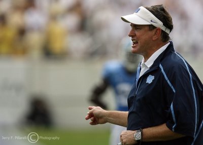 North Carolina Tar Heels Head Coach Butch Davis gives instructions to his team from the sidelines