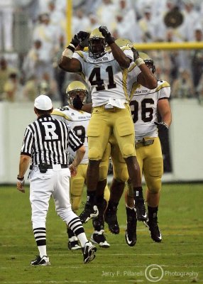 ...Jackets DE Egbuniwe celebrates his sack of Heels QB Yates